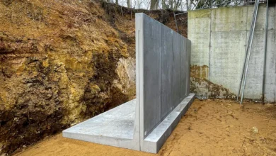 Building concrete wall retaining structures supporting sloped residential landscape