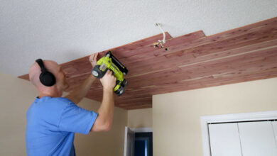 tongue and groove ceiling installed in modern living room with natural wood panels