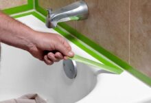 how to caulk a bathtub — cracked and peeling bathtub caulk line before removal and replacement