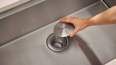 Blocked drain cleaning using plunger, baking soda, vinegar, and drain snake tools at home