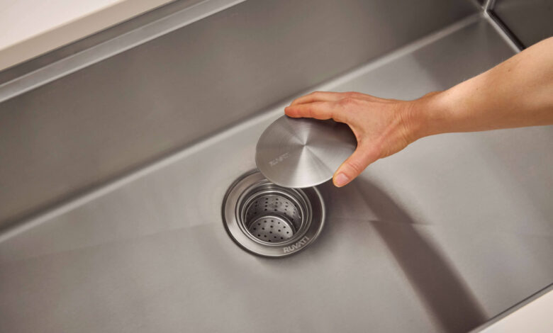 Blocked drain cleaning using plunger, baking soda, vinegar, and drain snake tools at home