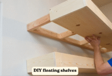 DIY floating shelves installed on a living room wall with wood finish