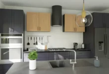 Invisible kitchen design with concealed appliances, handleless cabinetry, and a minimalist aesthetic blending seamlessly into open-plan living